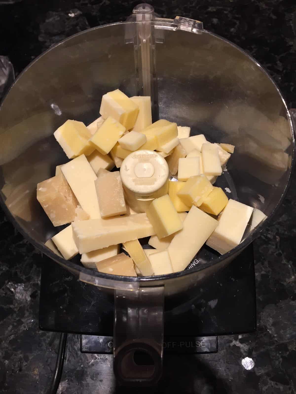 cubes of cheese in a food processor.