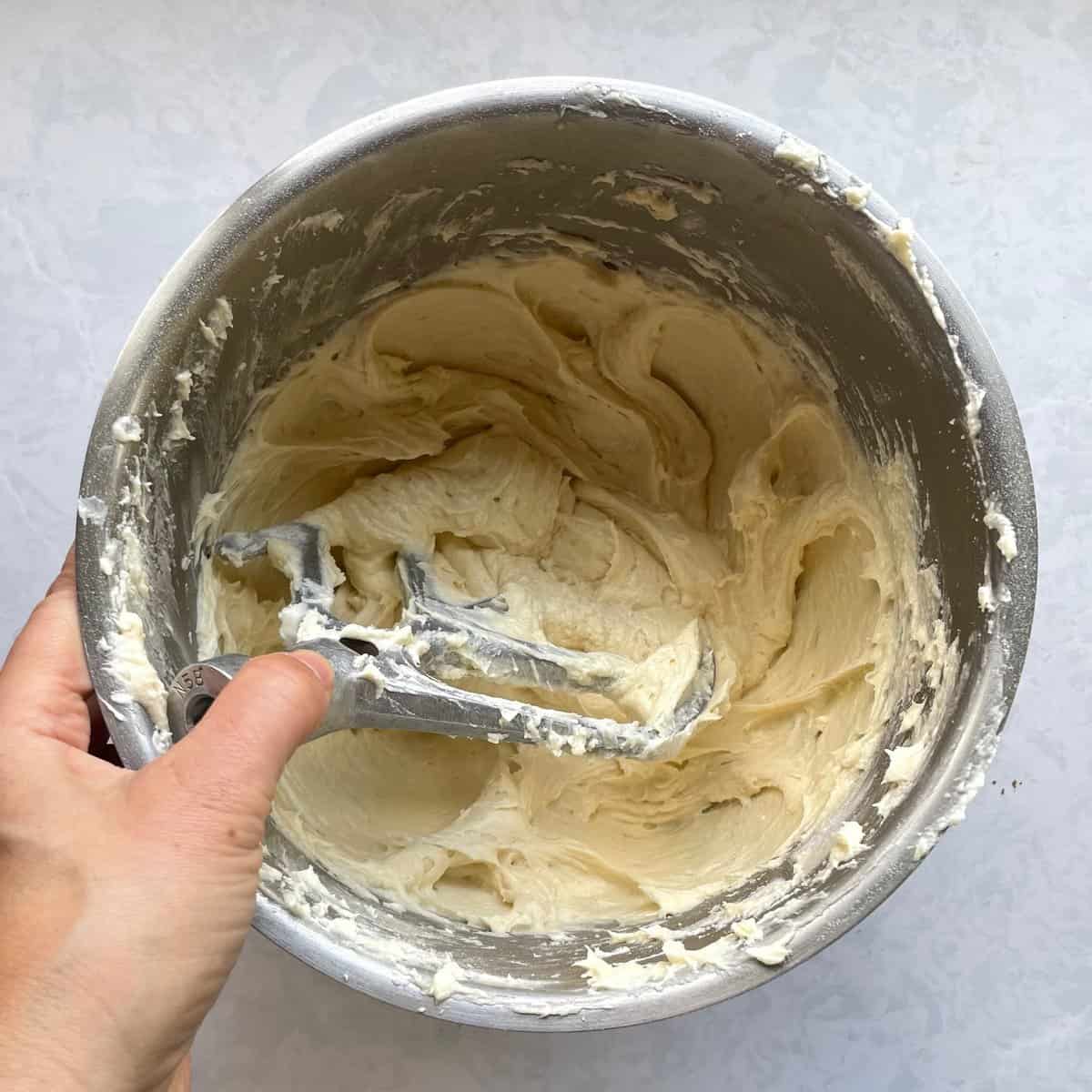 mixing bowl with thicker white batter.