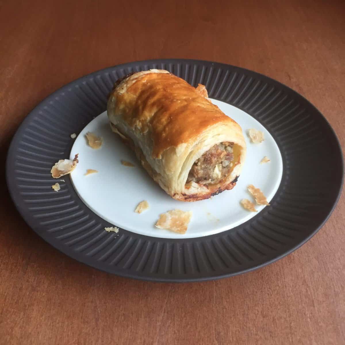 a sausage roll on a plate