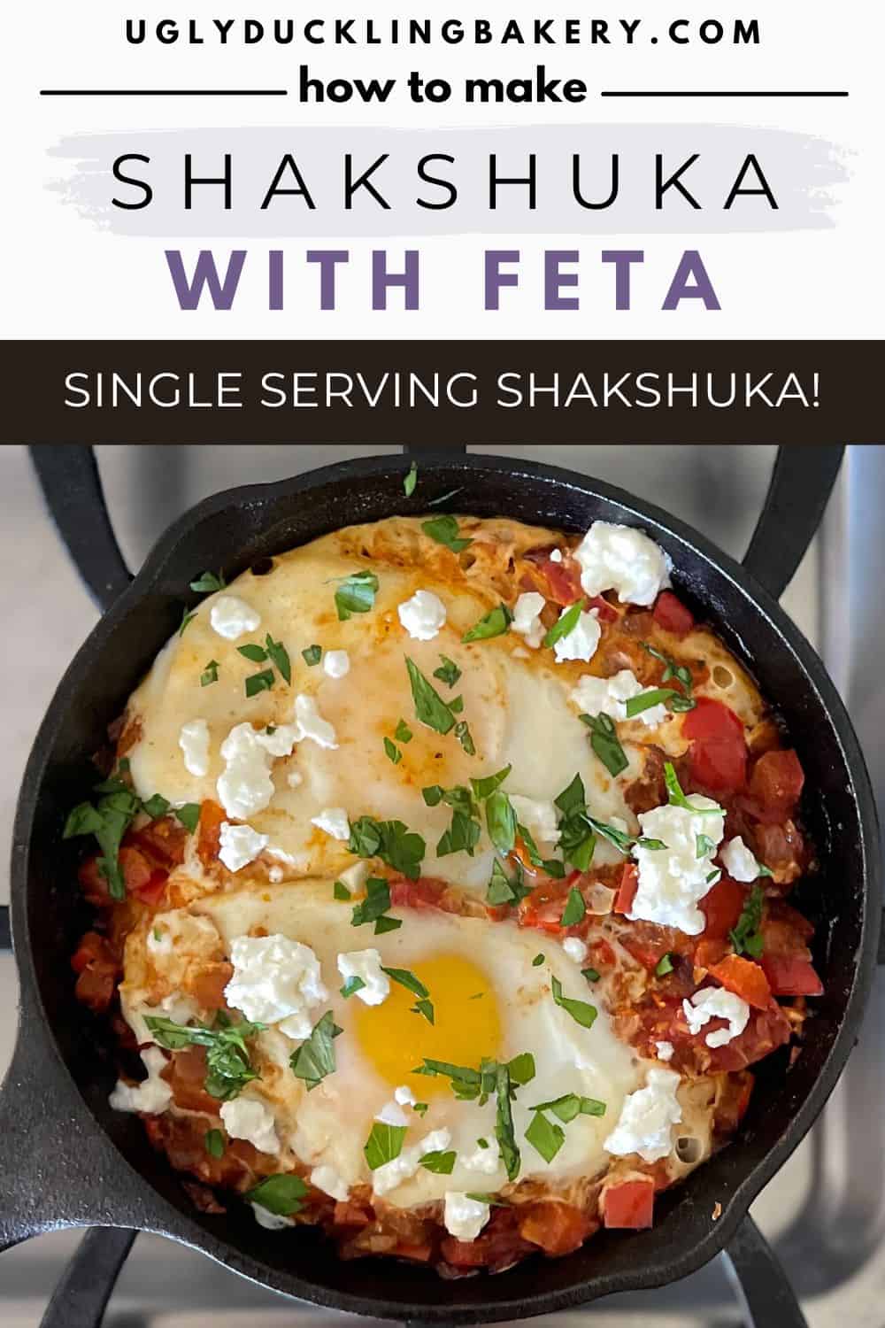 Single serving shakshuka for one person in small cast iron pan with eggs, feta, and herbs. The title says How to Make Shakshuka with Feta. A single serving shakshuka for one. The website ugly duckling bakery dot com is at the top.