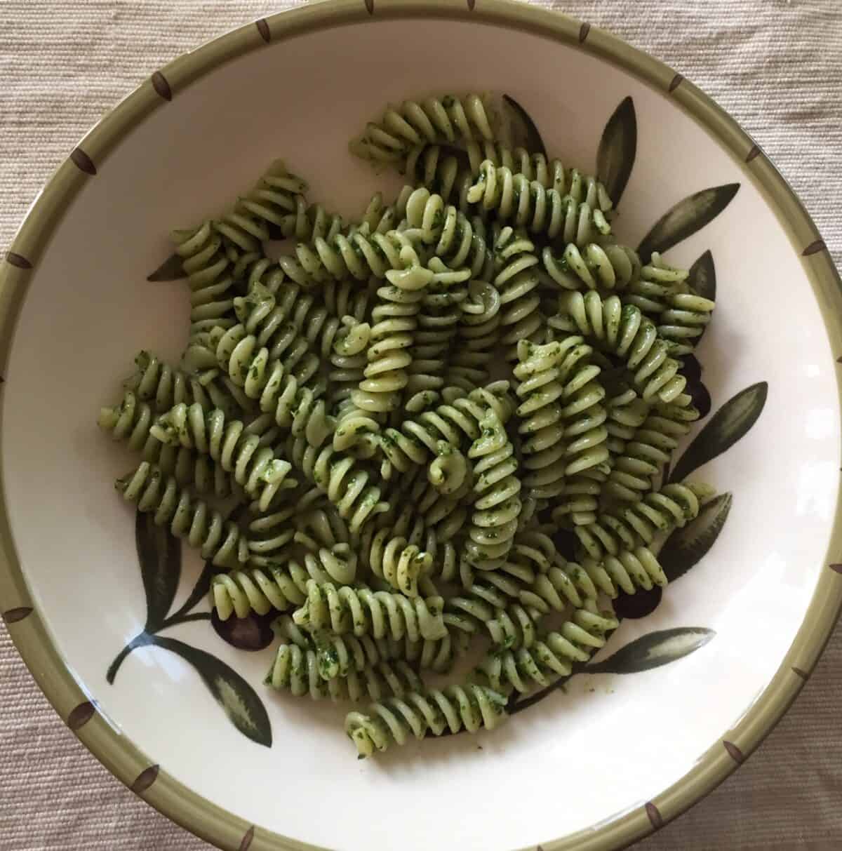 fusilli with pesto in a pasta bowl.