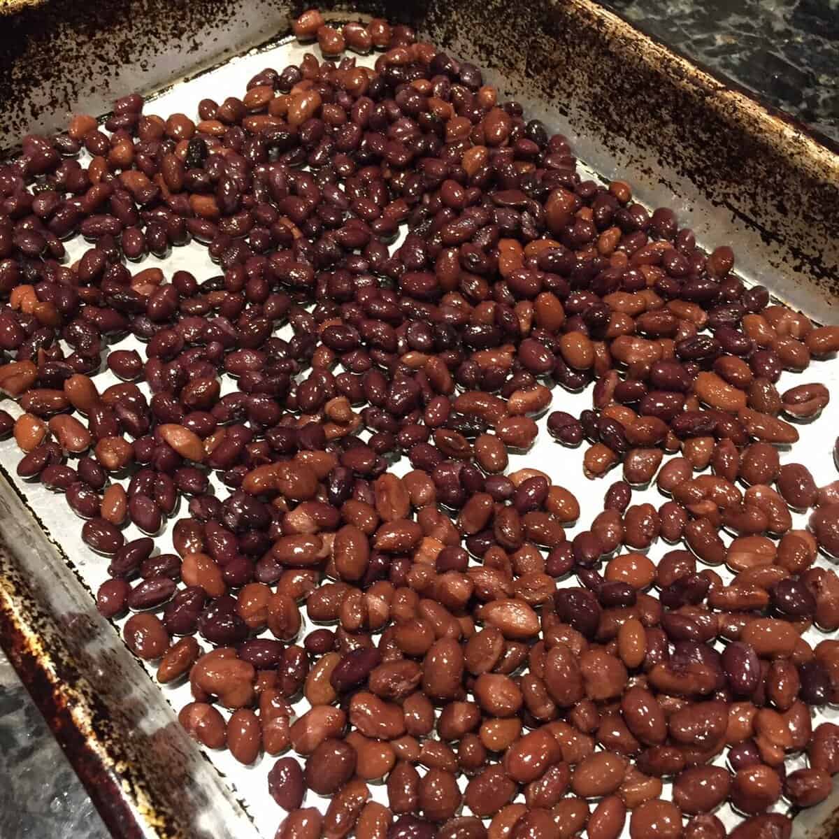 a pan of black beans of two different colors.