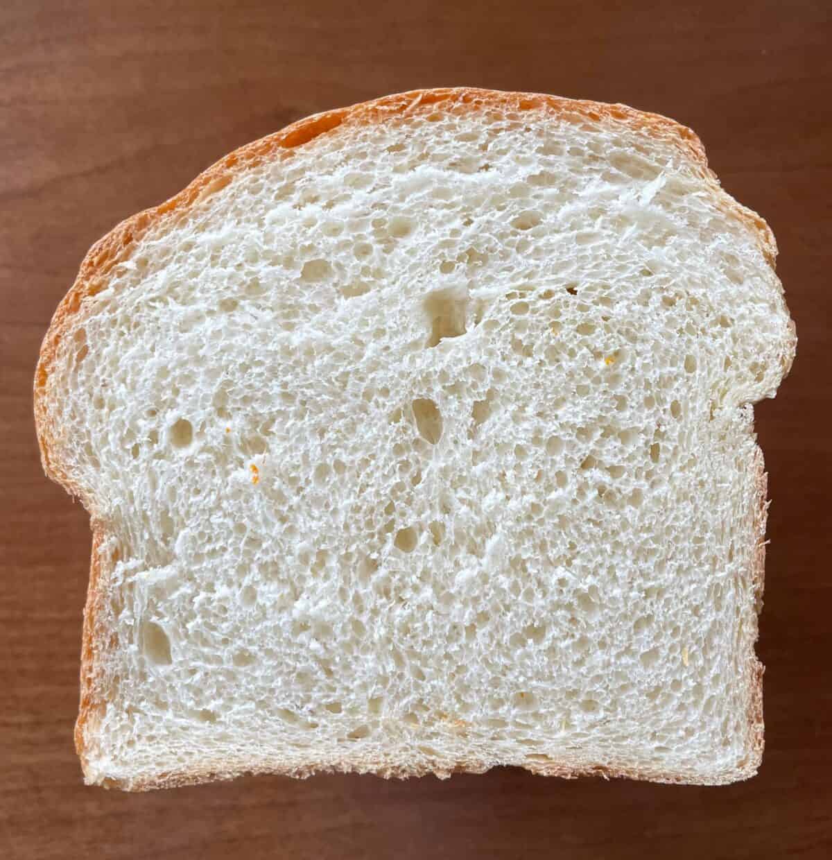 slice of Portuguese sweet bread showing the crumb.