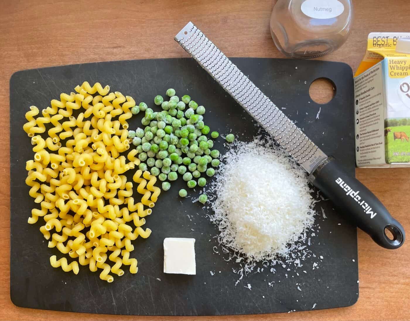 cavatappi, butter, cream, Parmesan and other ingredients for the cavatappi alfredo recipe.