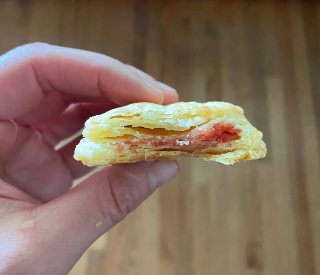 the flaky inside of a strawberry heart pop tart.