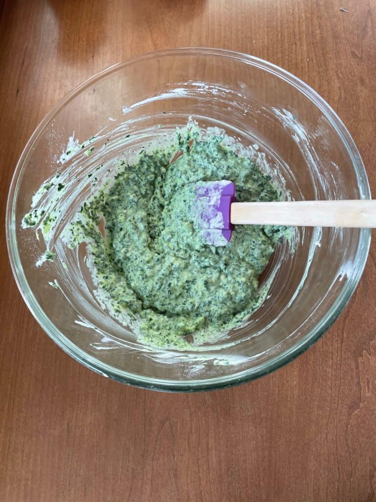 the kale waffle mixture in a glass bowl.