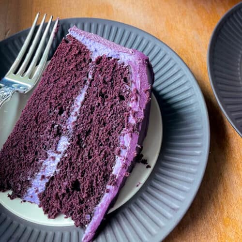 a piece of purple velvet cake on a plate.
