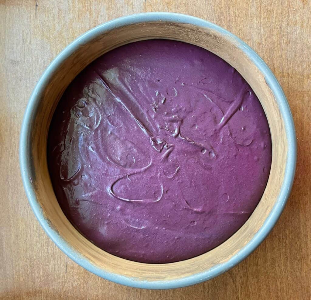 purple cake batter in a pan.