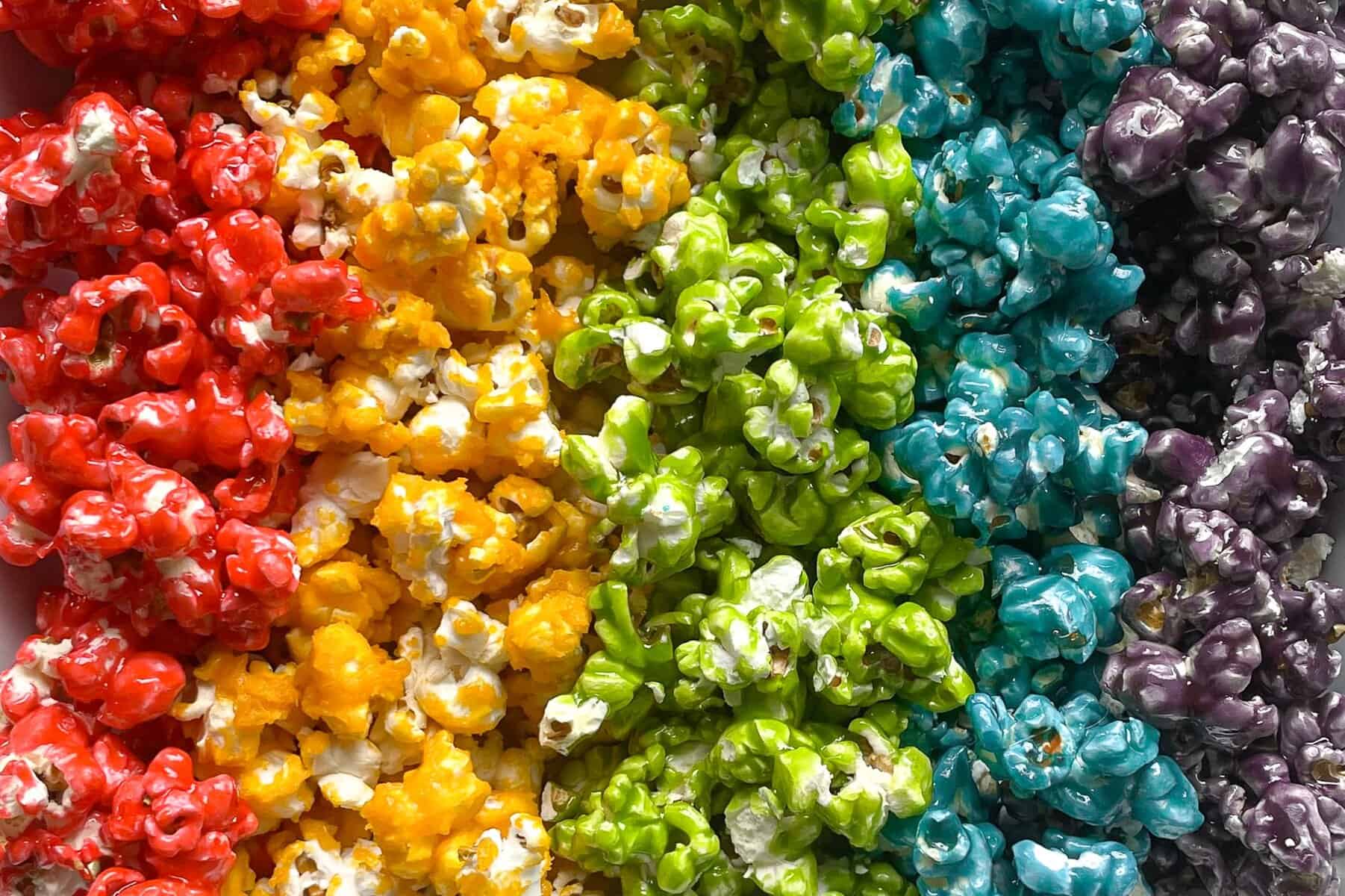 stripes of rainbow colored popcorn. 