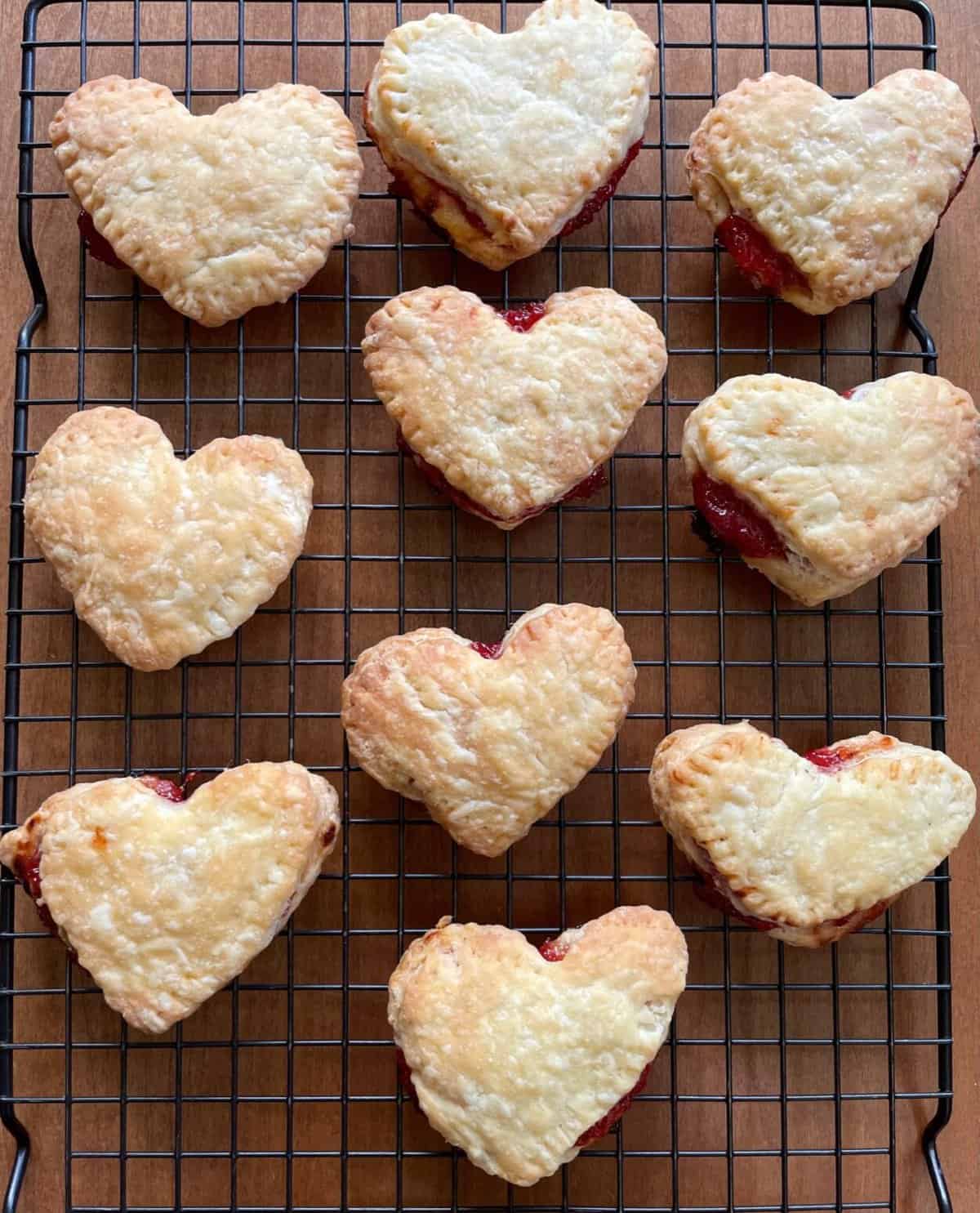 strawberry heart pop tarts on a cooling rack.