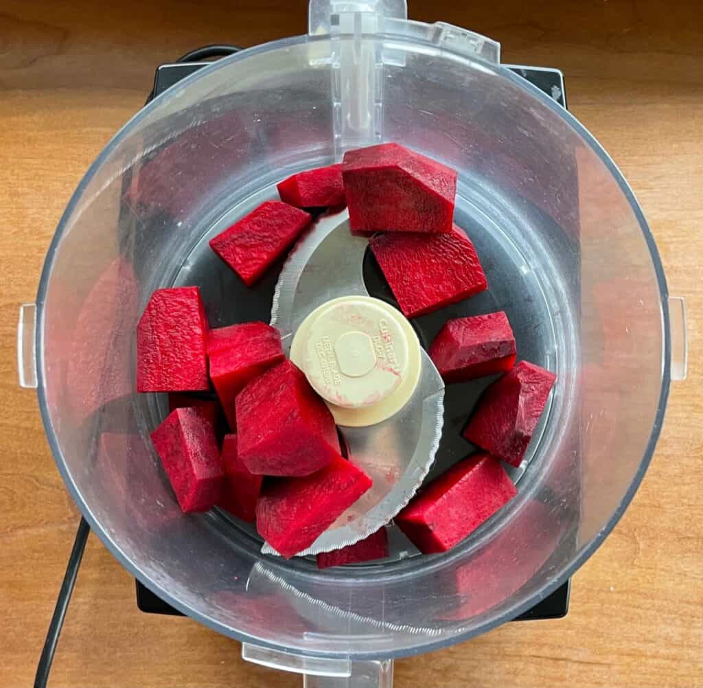 raw beets in a food processor.