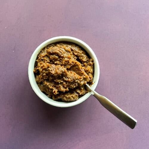 fig bacon jam in a small bowl with a spoon.