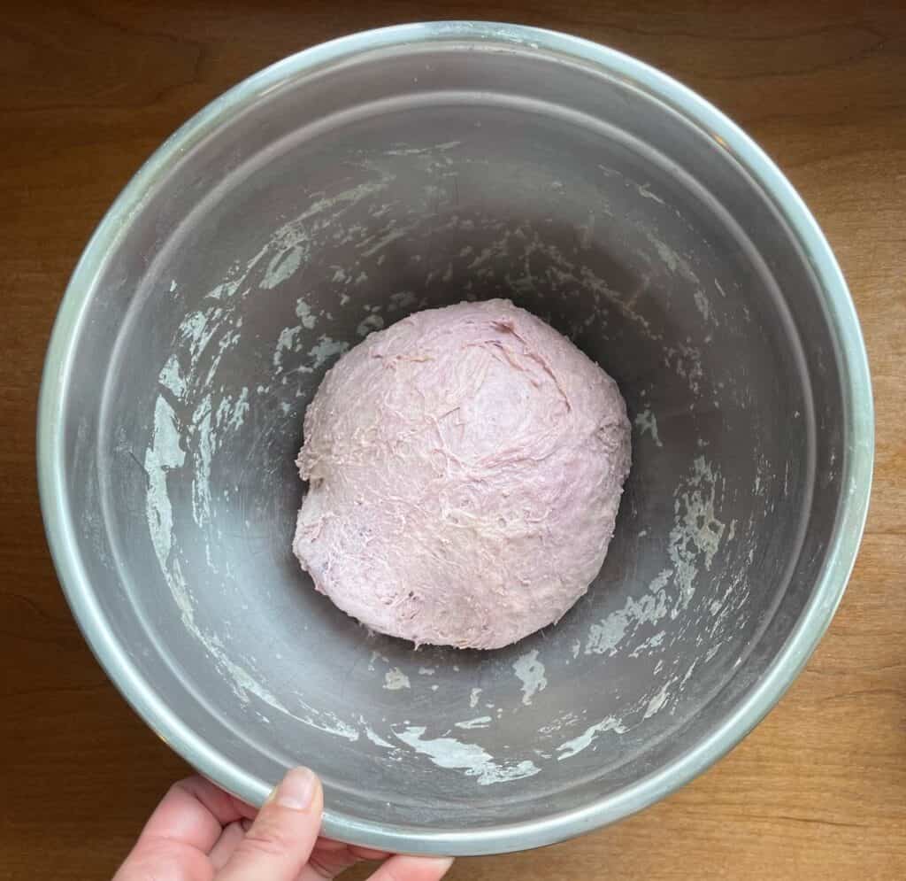 a boule of purple sweet potato sourdough bread dough