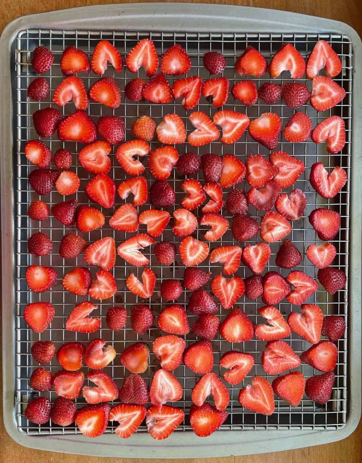 fresh sliced strawberries on a rack.