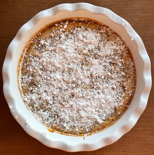 The baked clafoutis dusted with powdered sugar.
