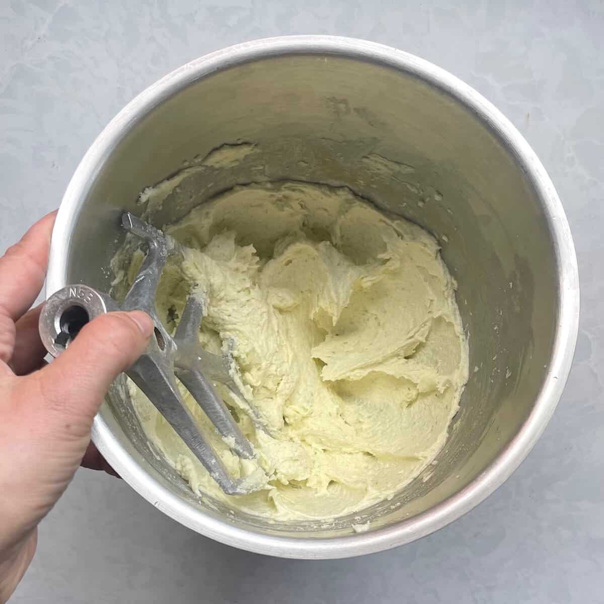 mixing bowl with creamed butter, sugar, and eggs.