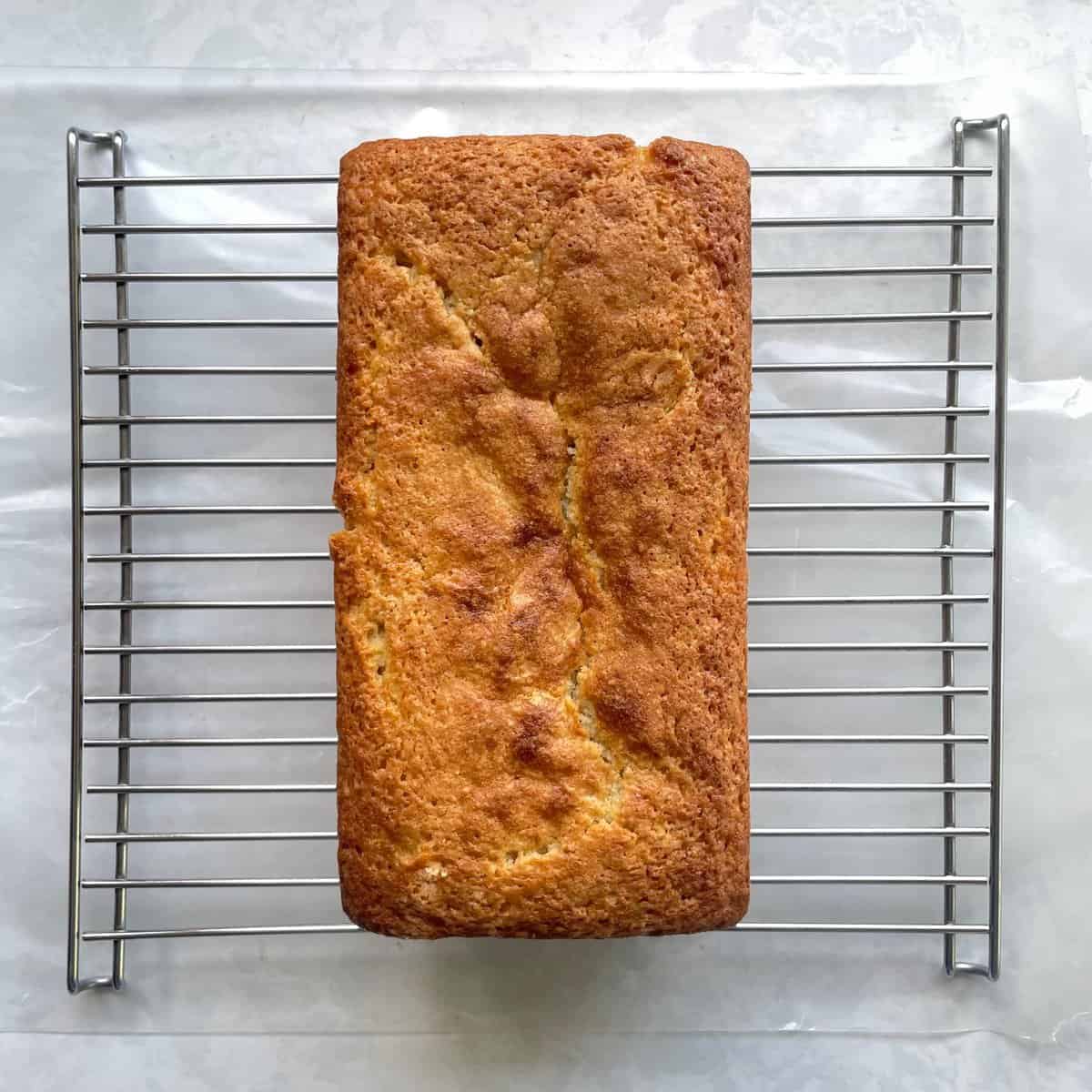 baked lime loaf cake on a cooling rack.