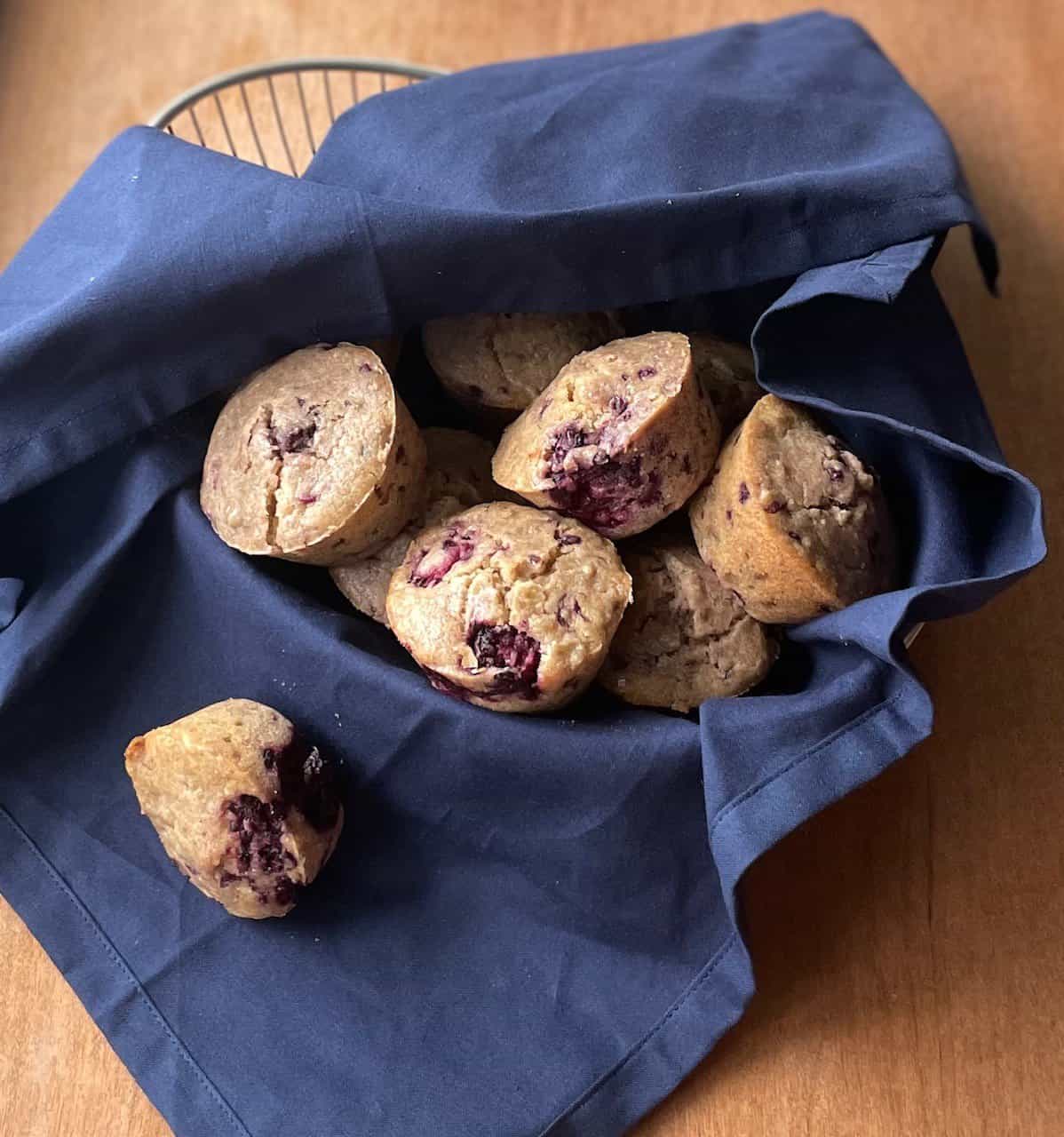 a basket of oatmeal blackberry muffins.