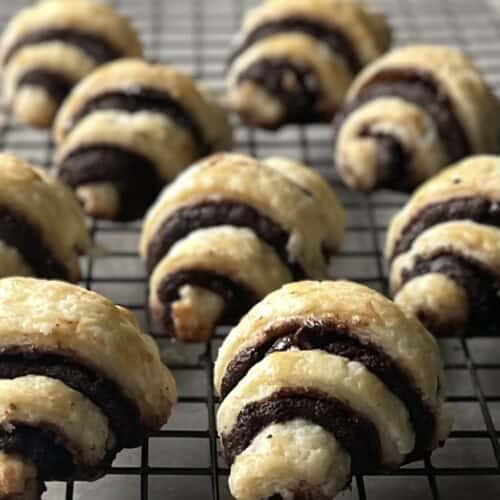 chocolate rugelach on a cooling rack.