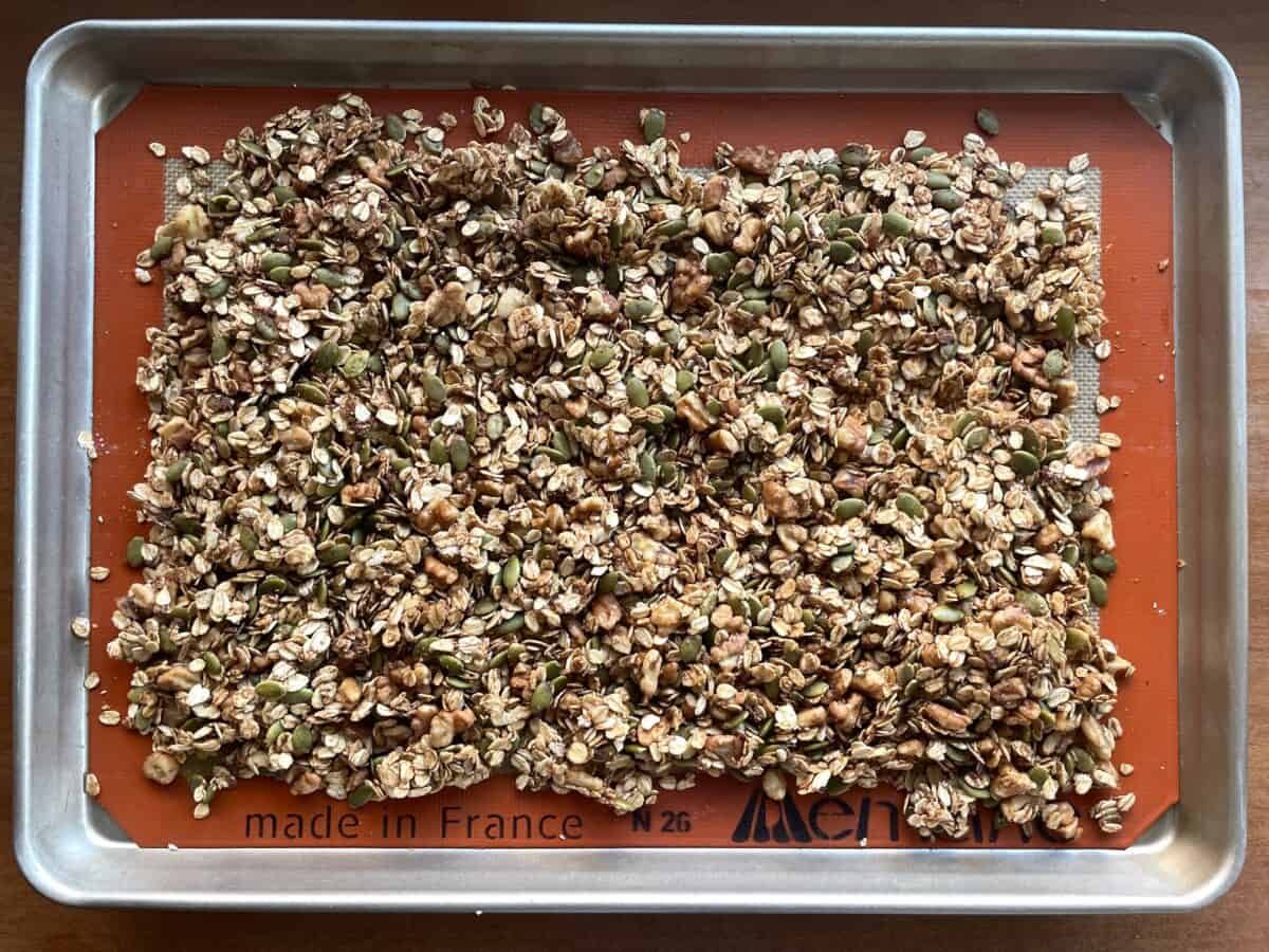 a sheet pan with baked gourmet granola.