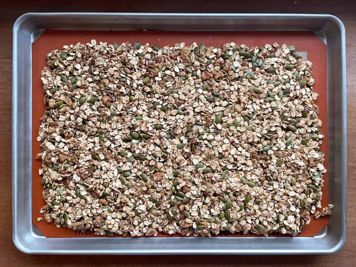 a sheet pan with unbaked pumpkin seed granola.