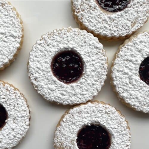 shortbread Linzer cookies dusted with confectioners sugar.