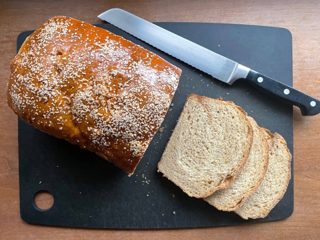 a loaf of pretzel bread on a cutting board.