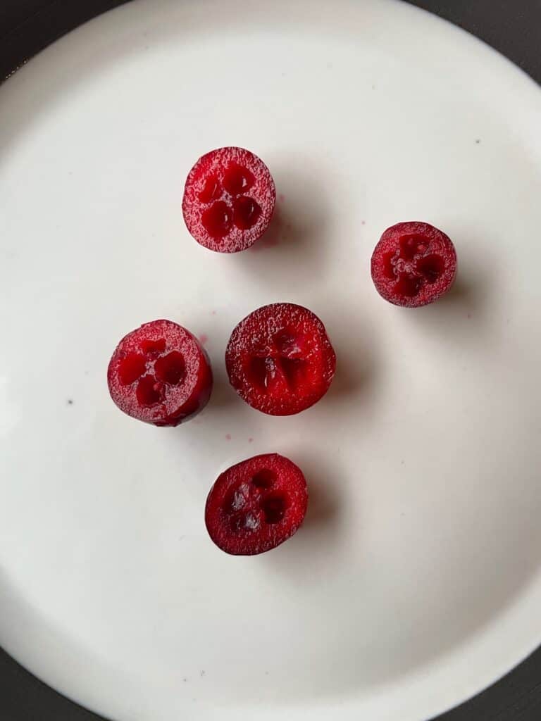 sliced cranberries on a plate.