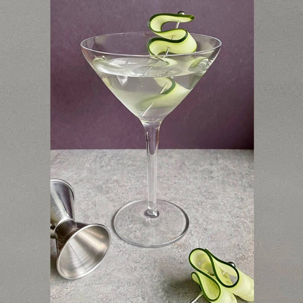 a cucumber martini with cucumber garnish.