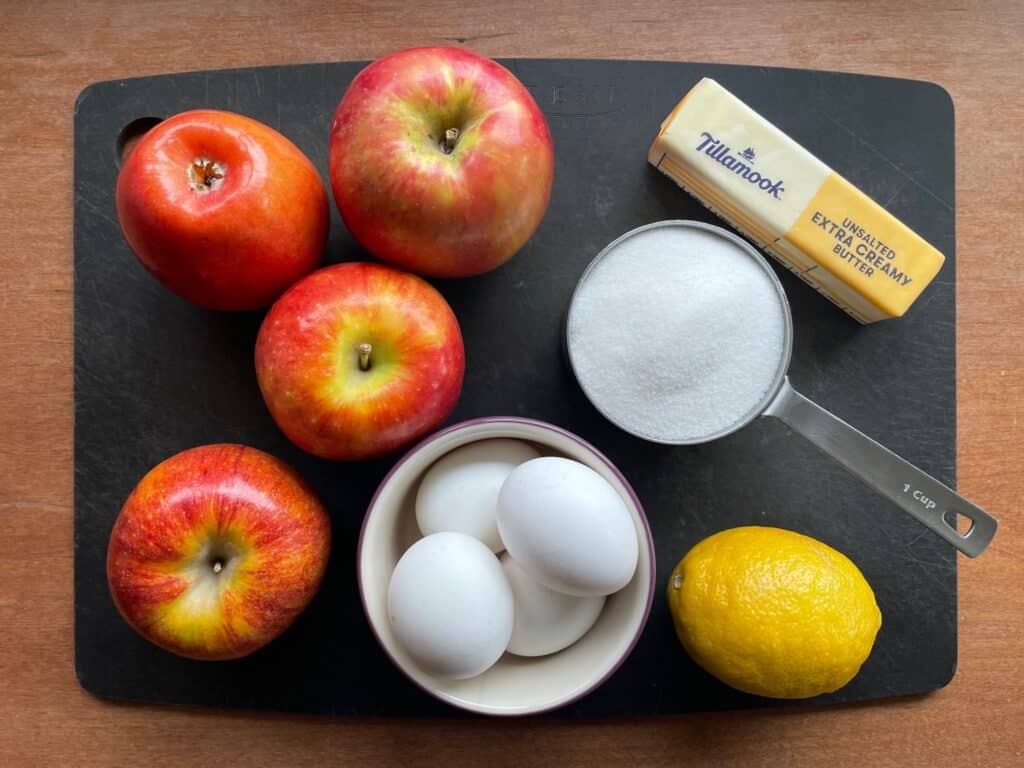 ingredients for the apple lemon curd on a cutting board.