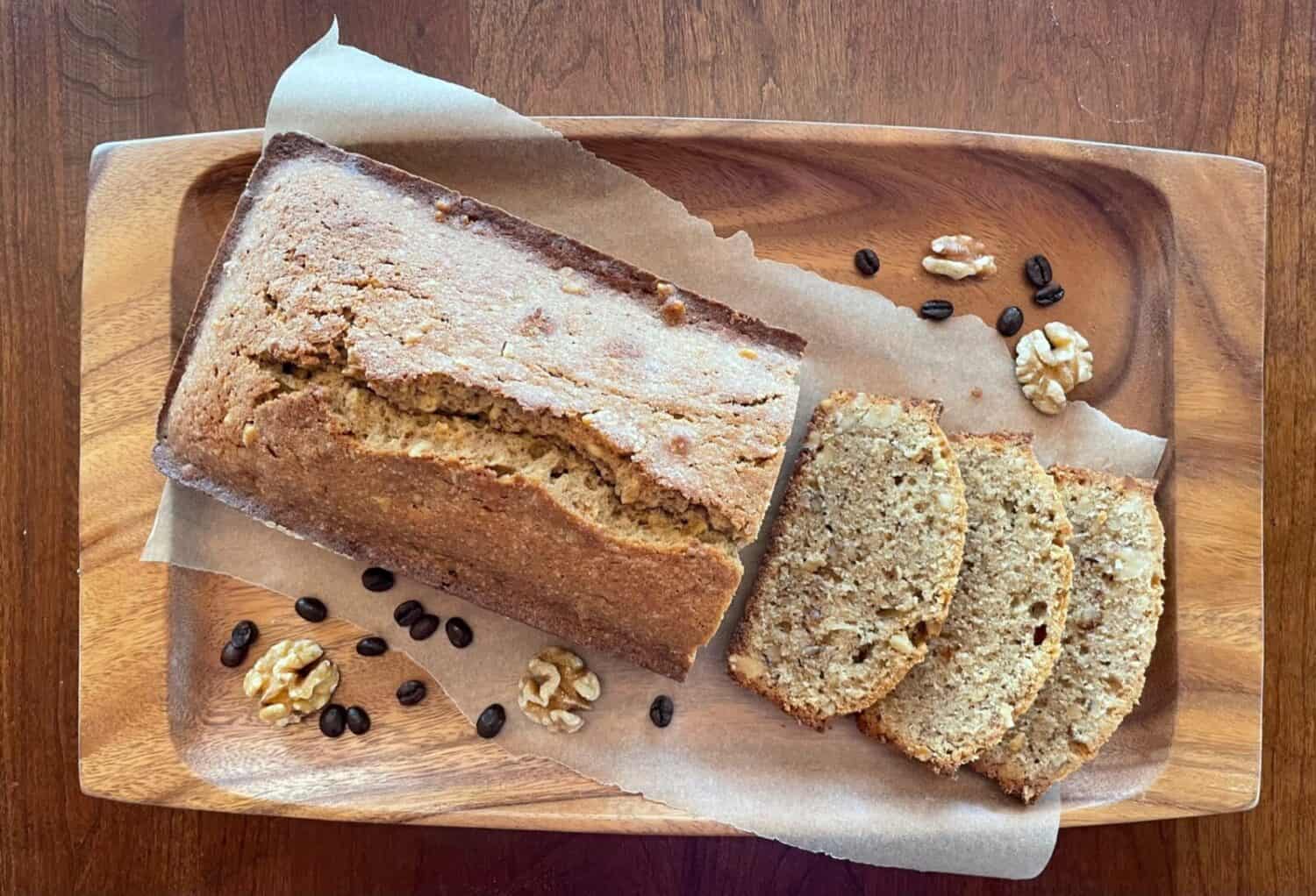 a coffee and walnut loaf and three cake slices.