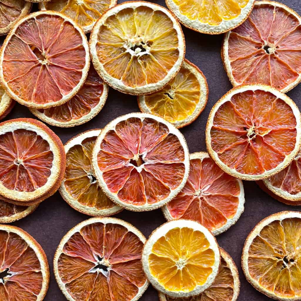 dried orange slices of different colors filling the shot.