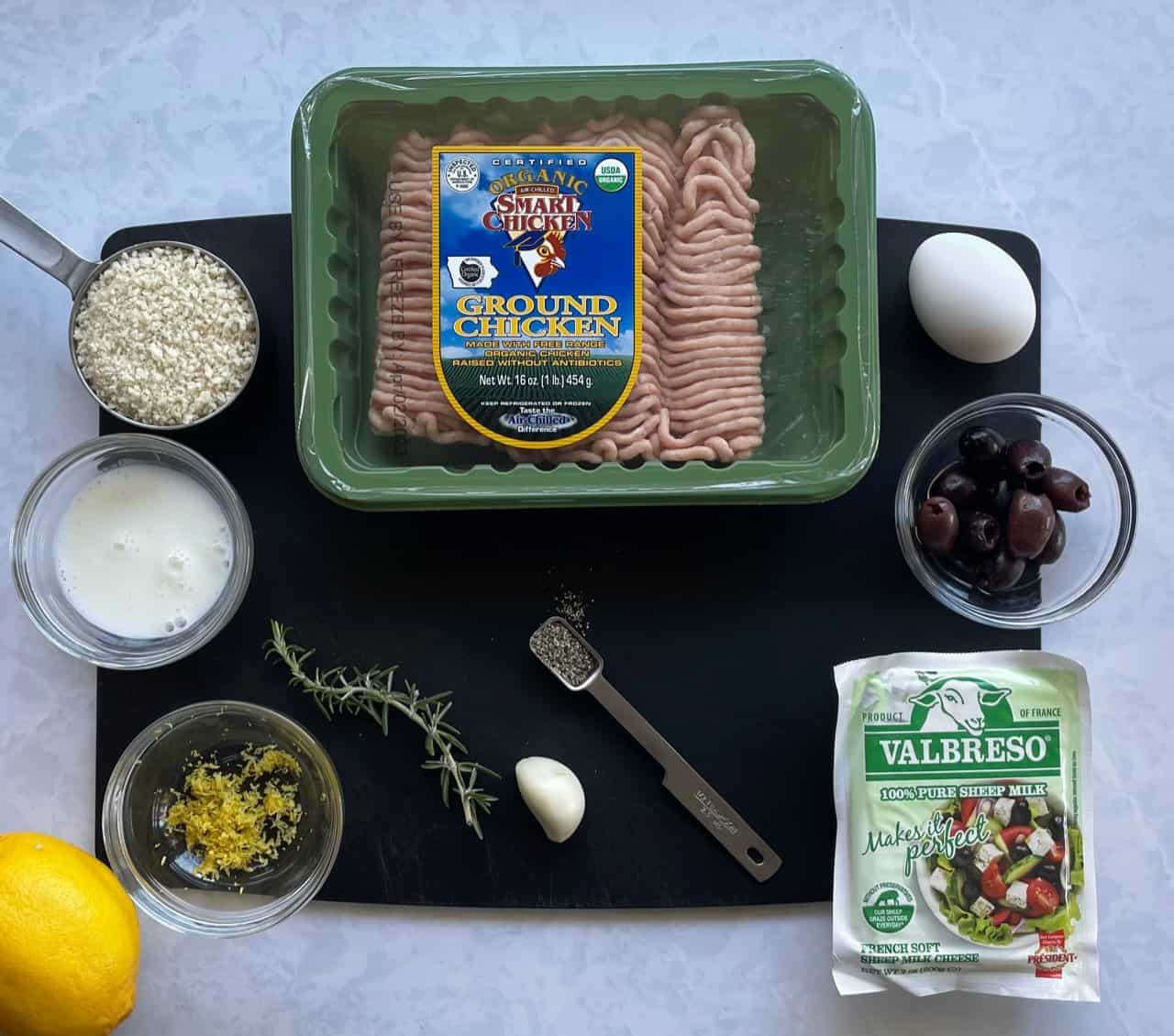 ground chicken, feta, and olives and other ingredients for the greek chicken meatballs.