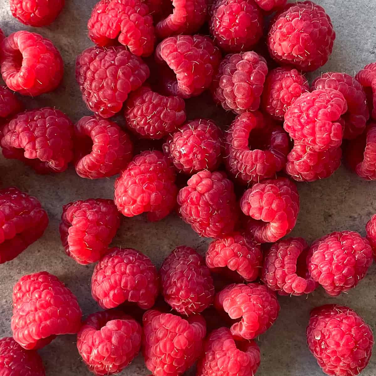 close up of bunch of fresh raspberries.