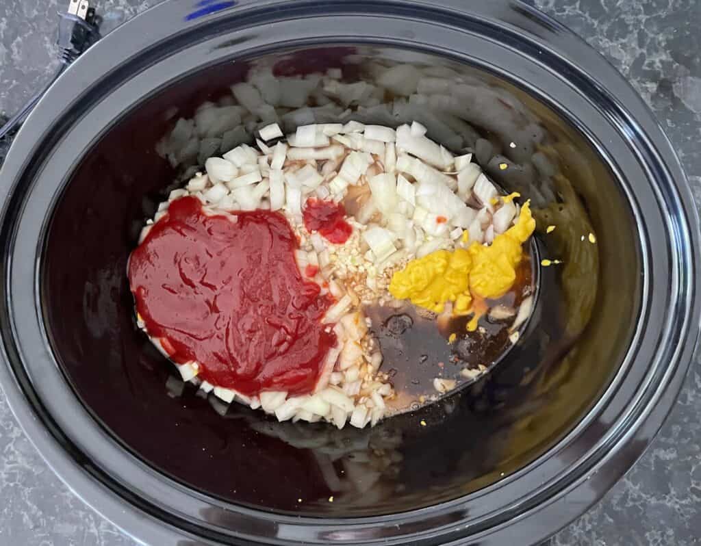 barbecue sauce ingredients in a slow cooker.