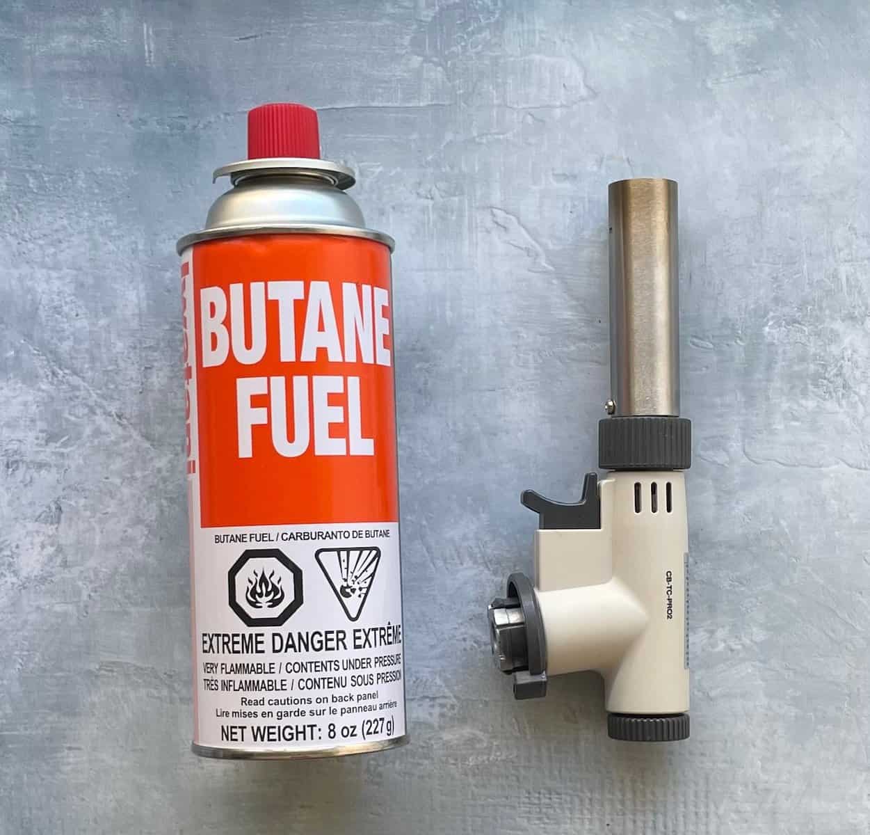 a butane torch and can of butane.