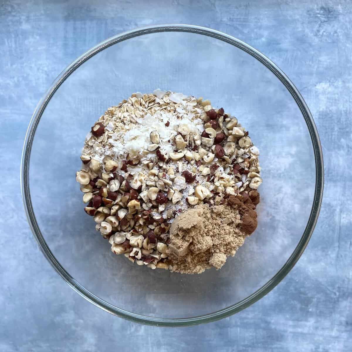 dry ingredients for homemade gourmet granola in a glass bowl. 