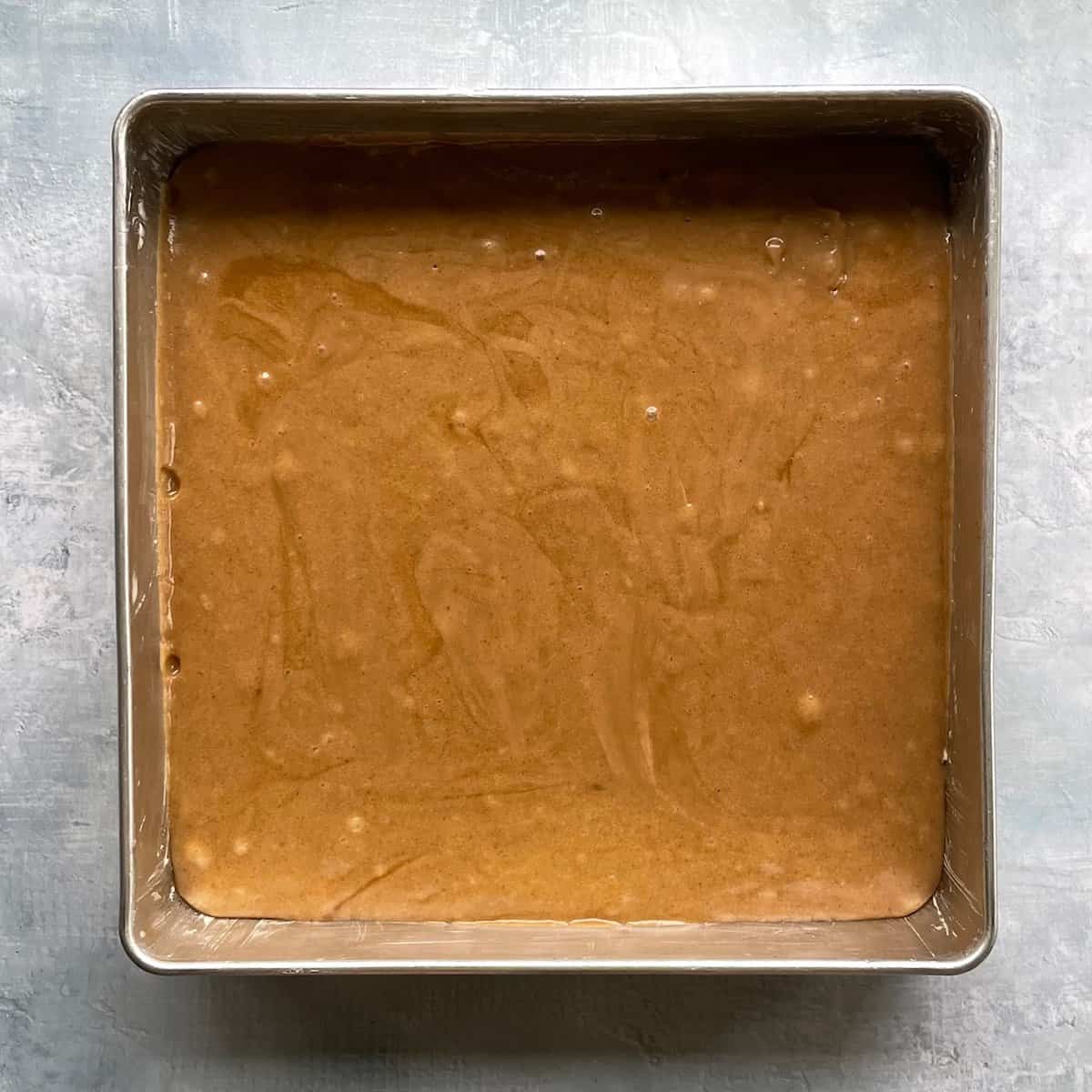 Biscoff blondie base in a greased square baking pan.