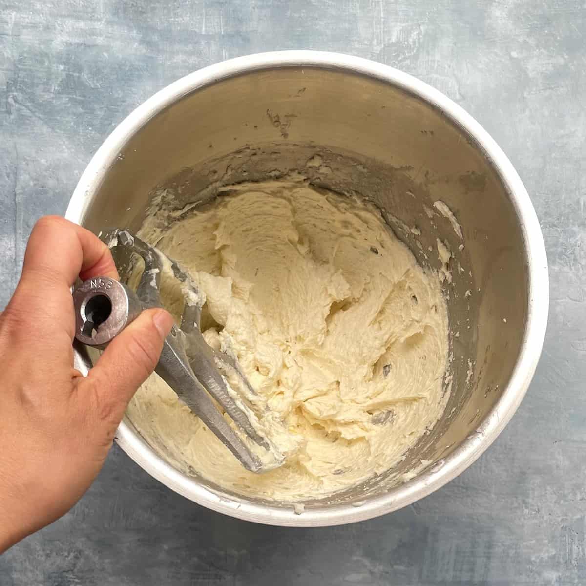 maple donut cake batter after mixing butter, sugar, eggs, and vanilla.
