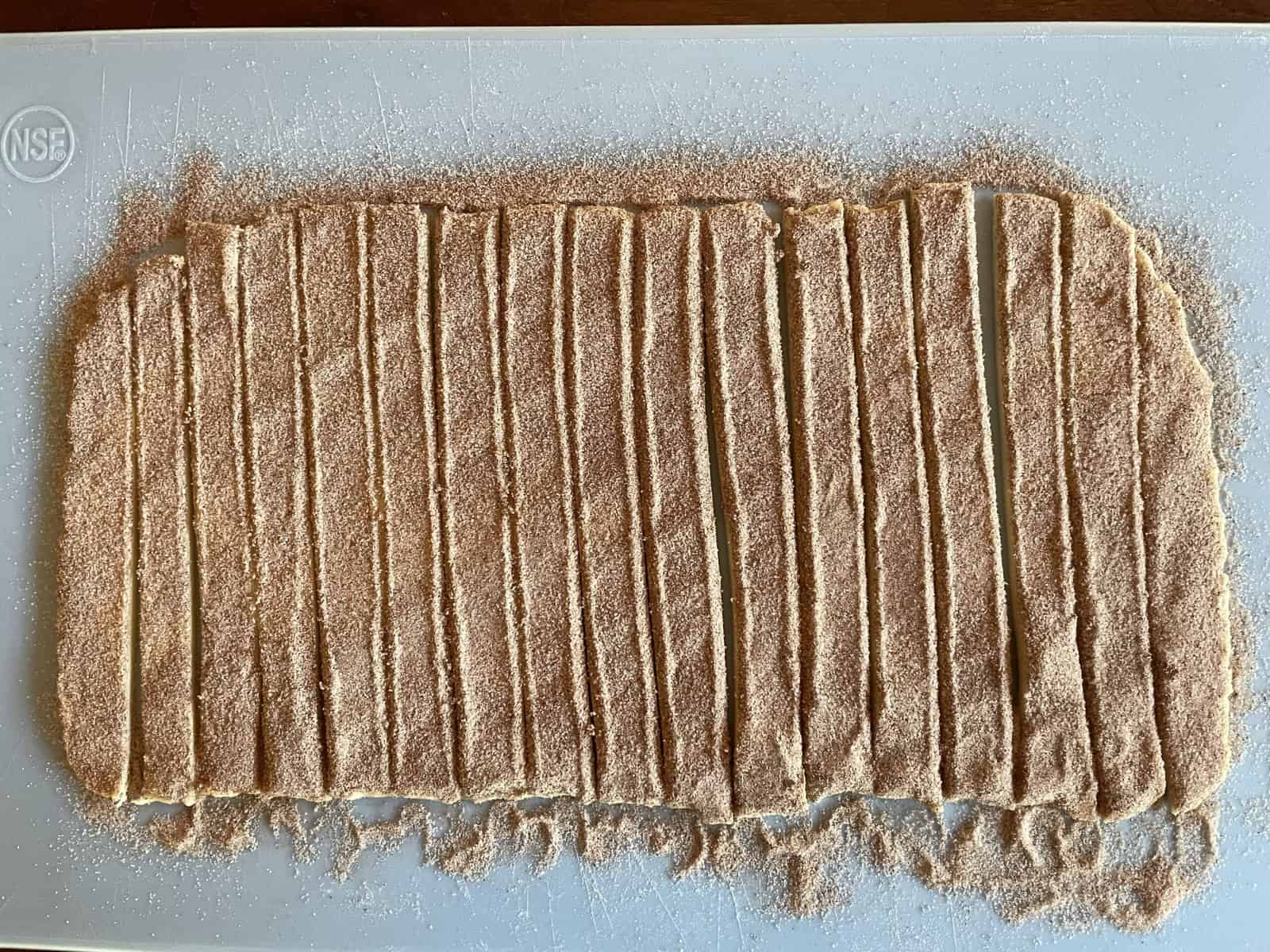 strips of pastry dough covered in cinnamon sugar.
