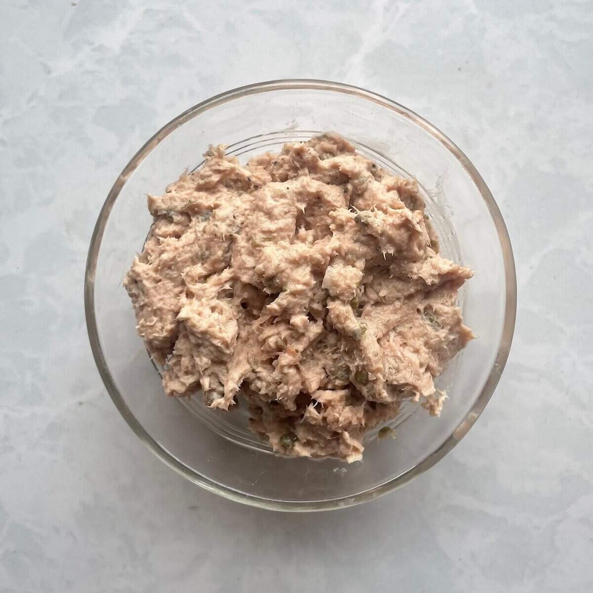 pureed tuna fish in a small glass bowl.