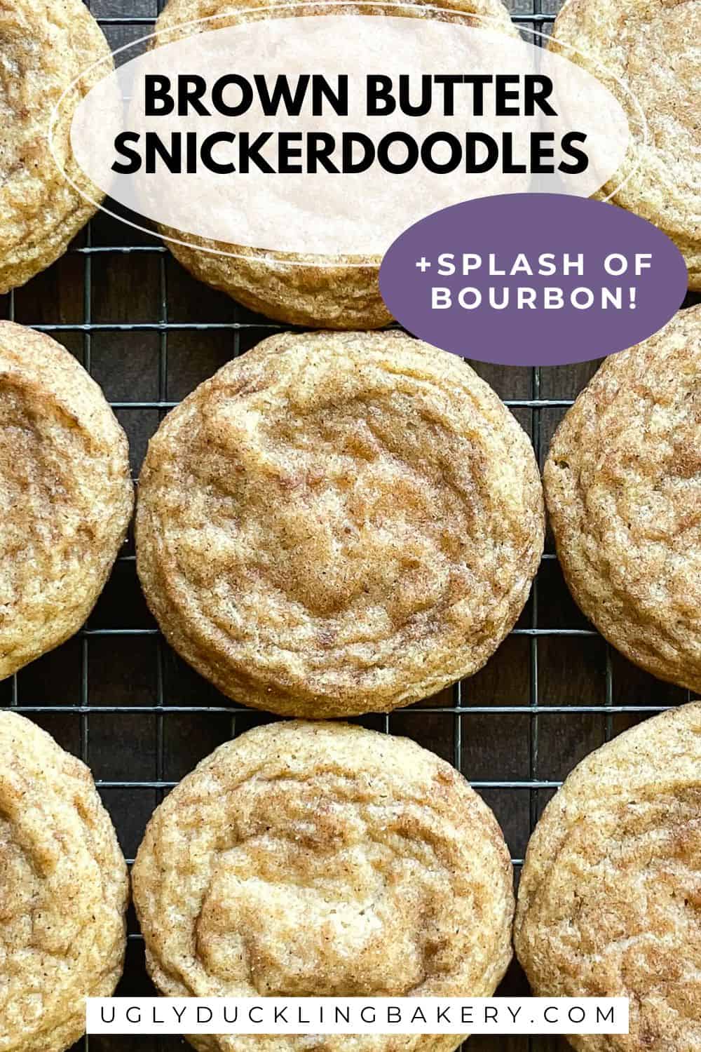 nine cookies on a baking rack. The title says brown butter snickerdoodles plus a splash of bourbon. The website ugly duckling bakery dot com is below.