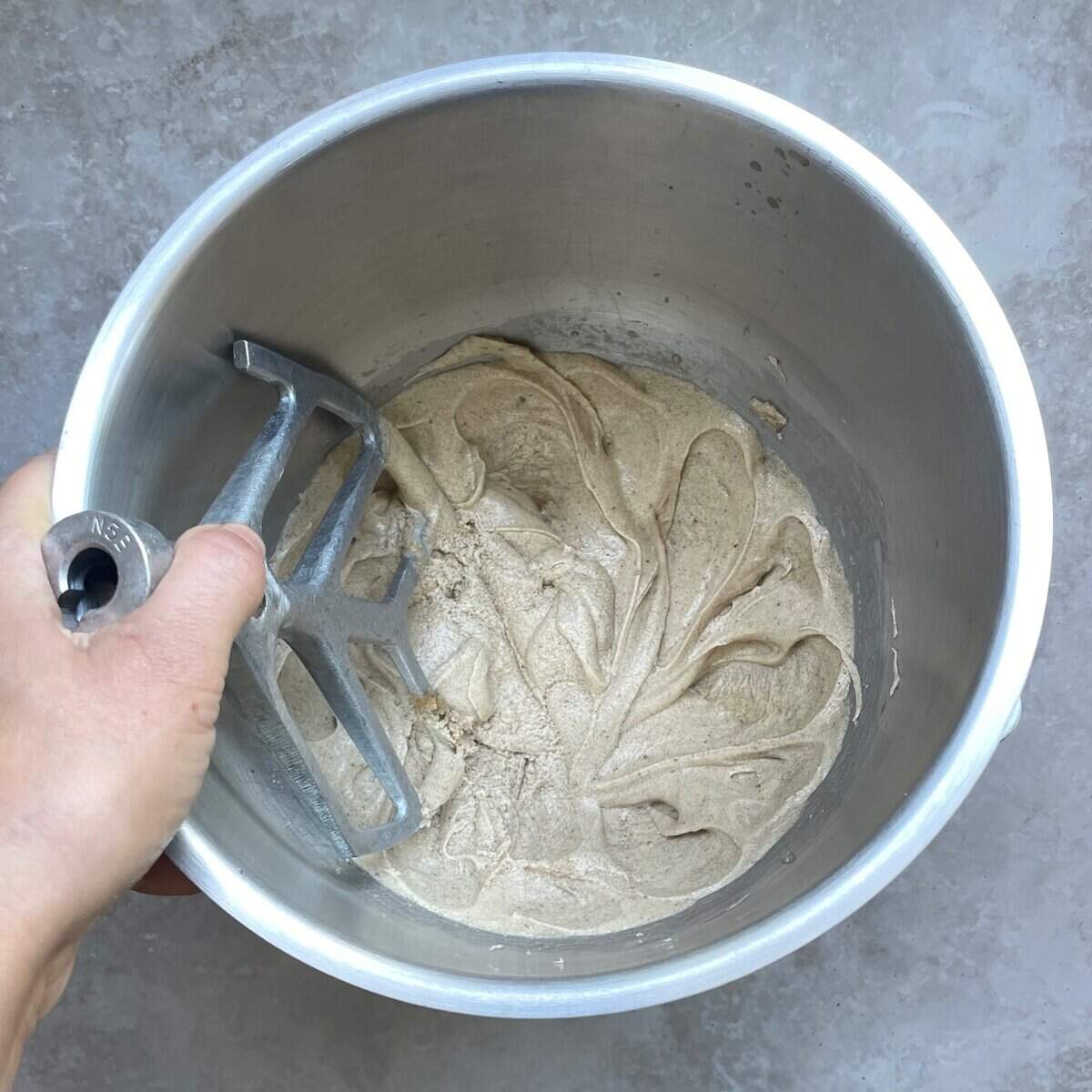 glossy pale cookie batter in a mixing bowl.