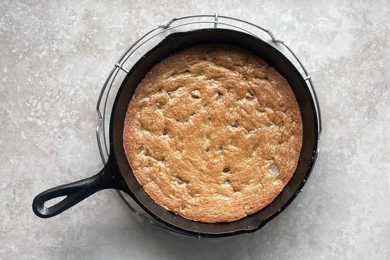 skillet chocolate chip cookie on a cooling rack.