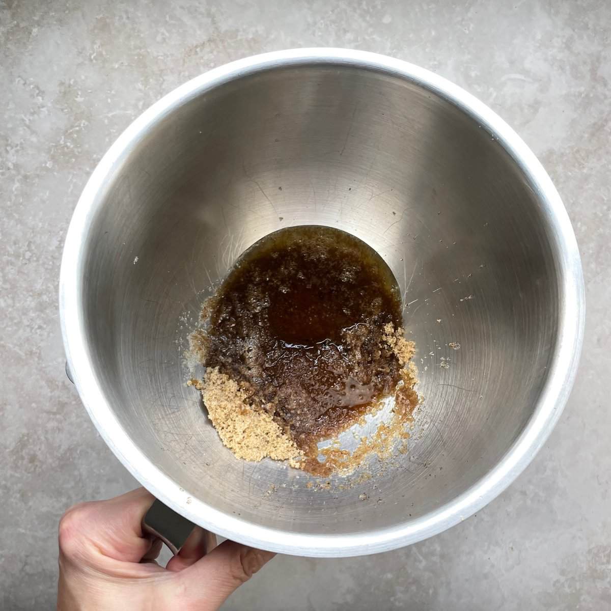 melted butter and sugar in a mixing bowl.