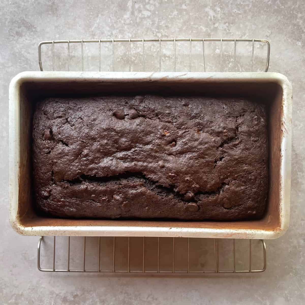 baked double chocolate banana bread on a cooling rack.